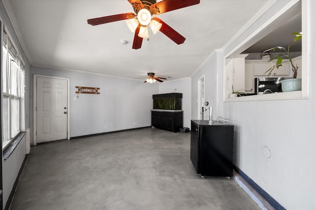 living room with concrete flooring and ornamental molding