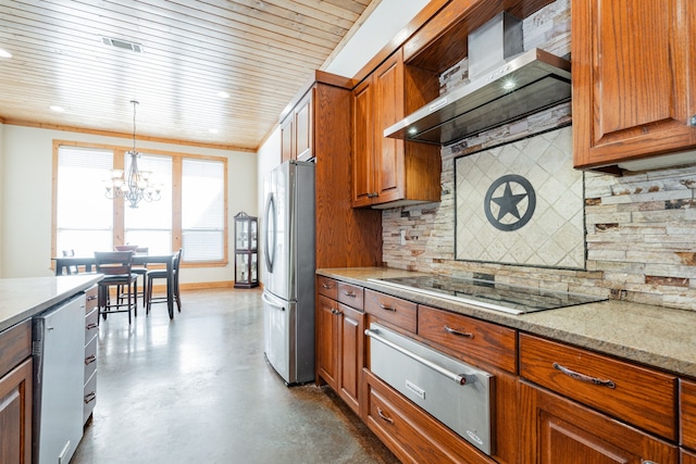 kitchen featuring stainless steel fridge, hanging light fixtures, wall chimney exhaust hood, black stovetop, and decorative backsplash