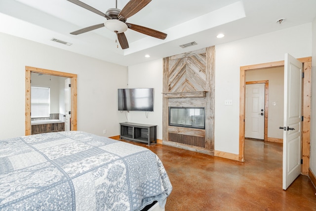 bedroom featuring ceiling fan and a raised ceiling