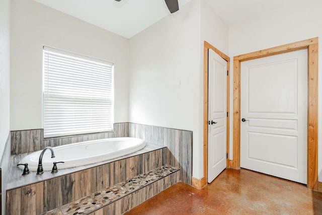 bathroom featuring ceiling fan and a bathtub