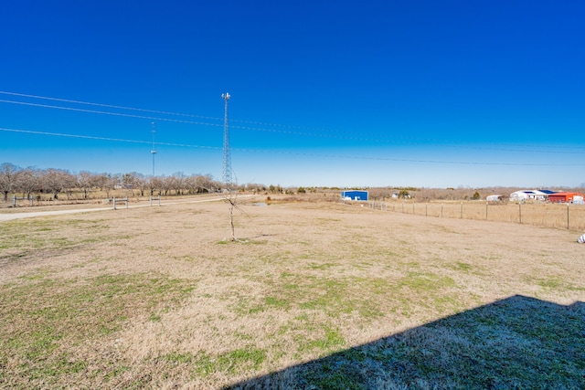 view of yard with a rural view