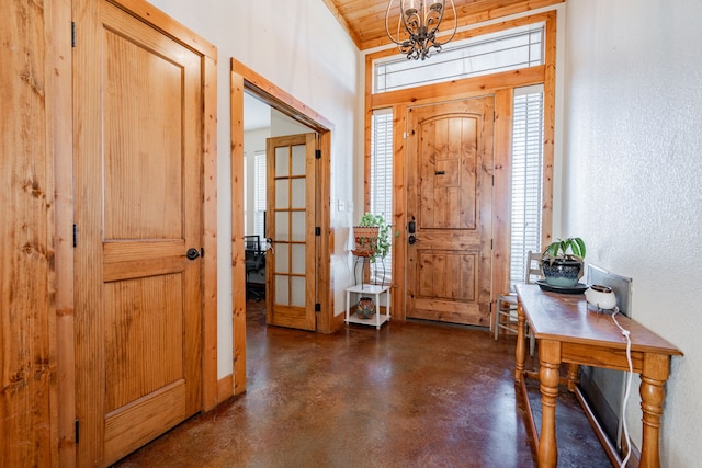 foyer entrance featuring wood ceiling and an inviting chandelier