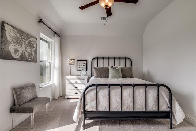 bedroom with carpet floors, vaulted ceiling, and ceiling fan