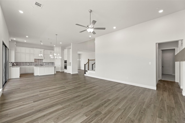 403 Spoonbill Rd, Sunnyvale, TX 75182 - unfurnished living room featuring a ceiling fan, stairs, wood finished floors, and recessed lighting