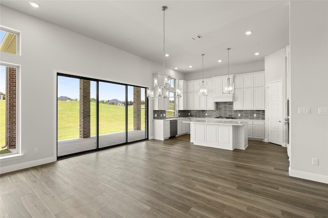 403 Spoonbill Rd, Sunnyvale, TX 75182 - kitchen with stainless steel dishwasher, white cabinetry, light countertops, dark wood-style flooring, and backsplash