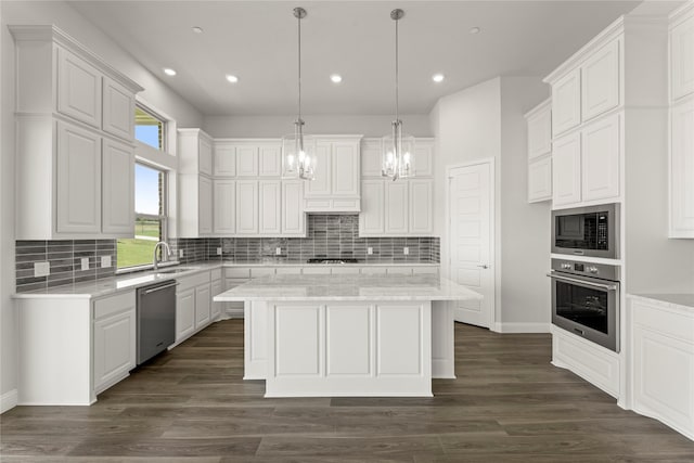 403 Spoonbill Rd, Sunnyvale, TX 75182 - kitchen featuring stainless steel appliances, a chandelier, a kitchen island, white cabinetry, and recessed lighting