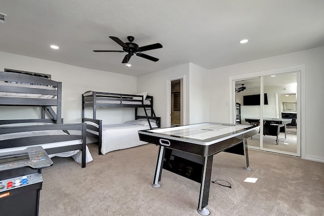 playroom with carpet floors and ceiling fan