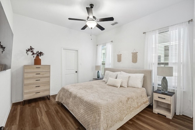 bedroom featuring dark hardwood / wood-style flooring and ceiling fan