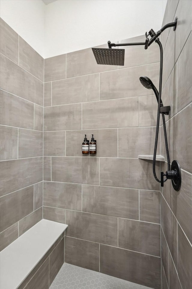 bathroom with a tile shower