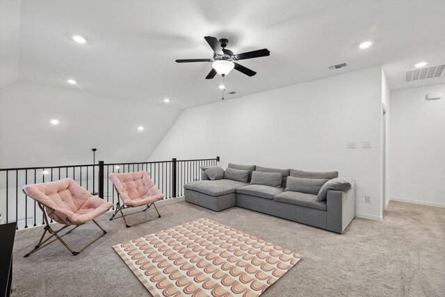 carpeted living room with vaulted ceiling and ceiling fan