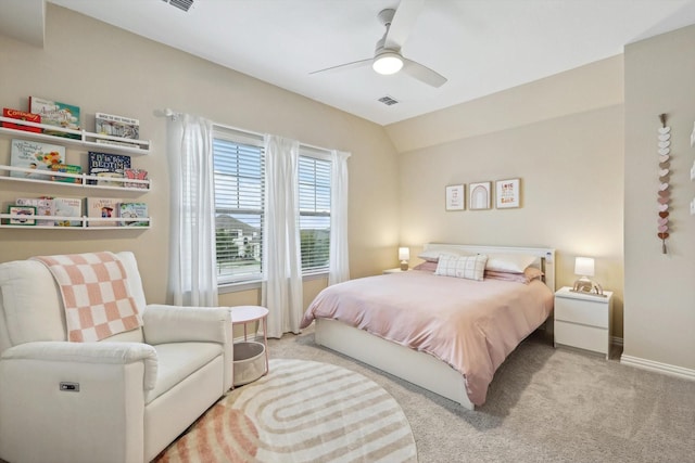 carpeted bedroom featuring ceiling fan and vaulted ceiling