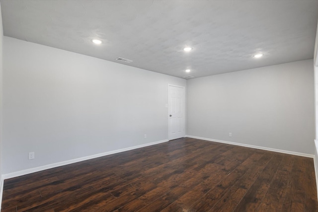 empty room featuring dark hardwood / wood-style floors