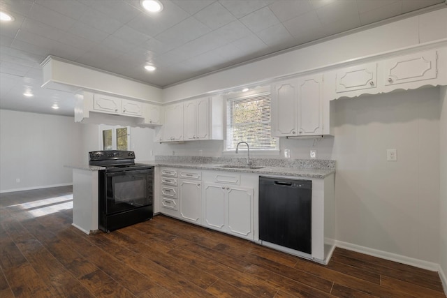 kitchen featuring dark wood-type flooring, white cabinetry, sink, and black appliances