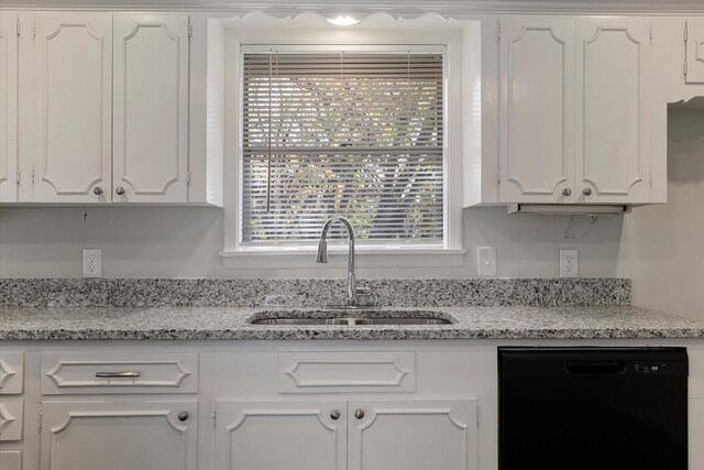 kitchen with white cabinetry and black dishwasher