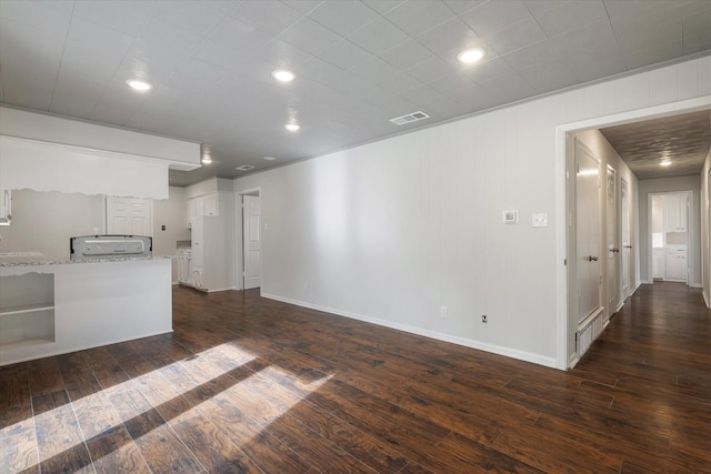 unfurnished living room with dark hardwood / wood-style floors