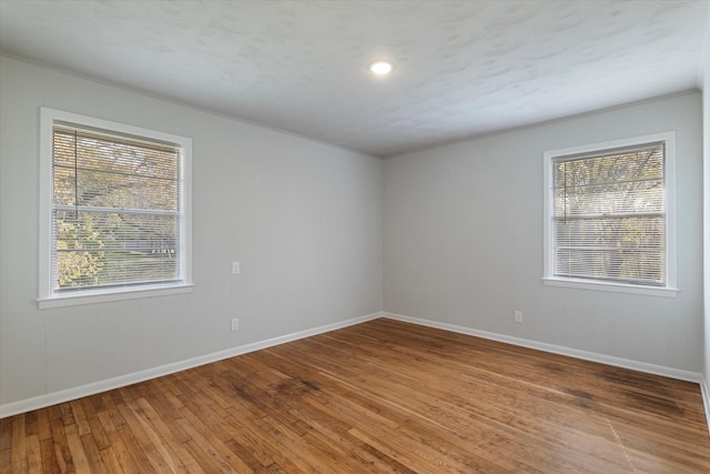 spare room featuring hardwood / wood-style floors