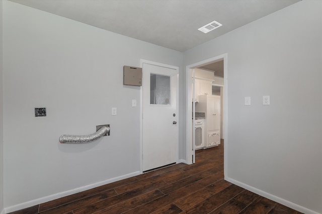 corridor featuring dark hardwood / wood-style flooring and washer / clothes dryer