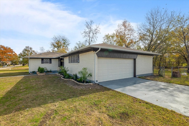 single story home with a garage and a front lawn