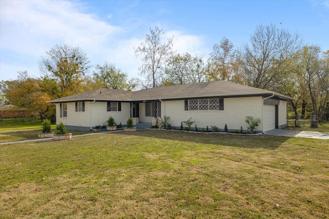 ranch-style home featuring a garage and a front lawn