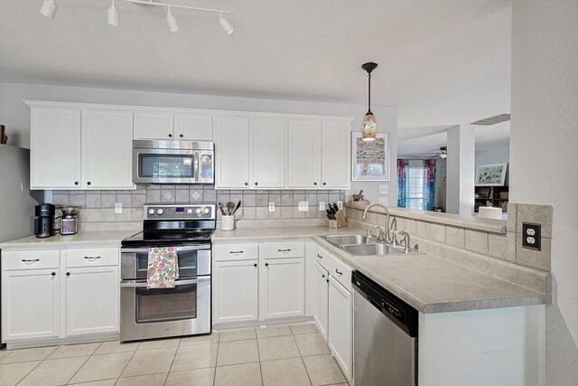 13324 Padre Ave, Fort Worth, TX 76244 - kitchen with appliances with stainless steel finishes, a sink, tasteful backsplash, and white cabinetry
