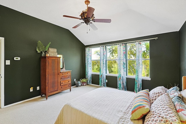 carpeted bedroom featuring vaulted ceiling and ceiling fan