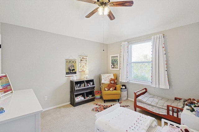 carpeted bedroom featuring vaulted ceiling and ceiling fan