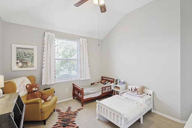 carpeted bedroom featuring lofted ceiling and ceiling fan