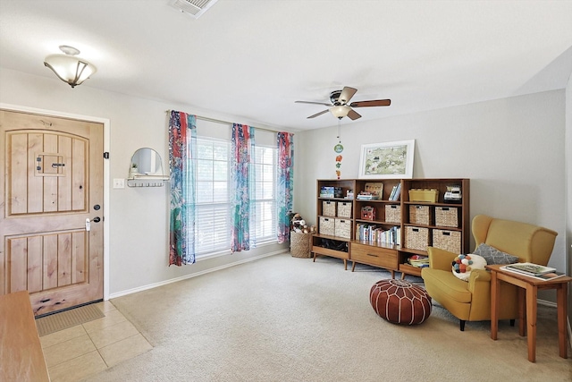 tiled foyer entrance featuring ceiling fan