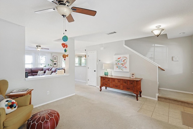13324 Padre Ave, Fort Worth, TX 76244 - sitting room featuring a ceiling fan, carpet floors, baseboards, stairway, and tile patterned flooring