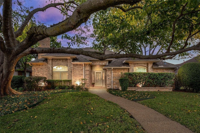 view of front of property with a yard