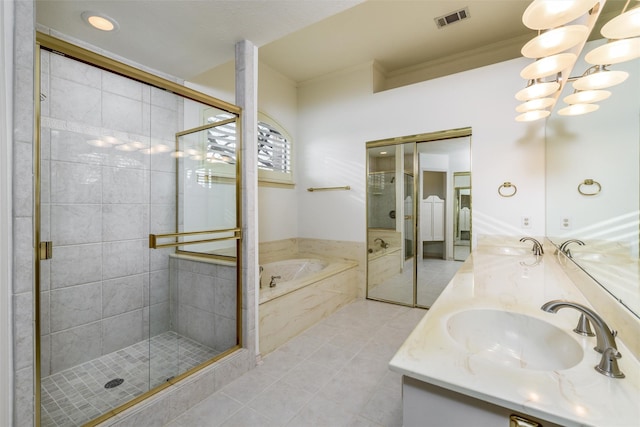 bathroom featuring ornamental molding, vanity, plus walk in shower, and tile patterned floors