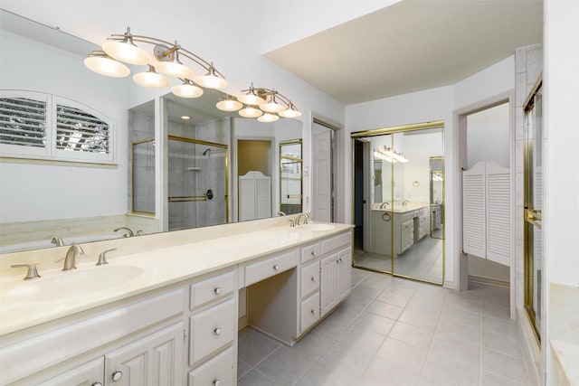 bathroom with vanity, tile patterned floors, and a shower with shower door