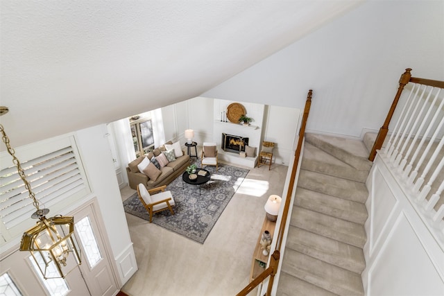 living room featuring a large fireplace