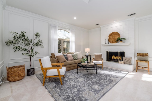 living room with carpet flooring, a fireplace, and ornamental molding