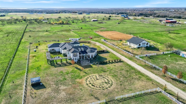 birds eye view of property with a rural view