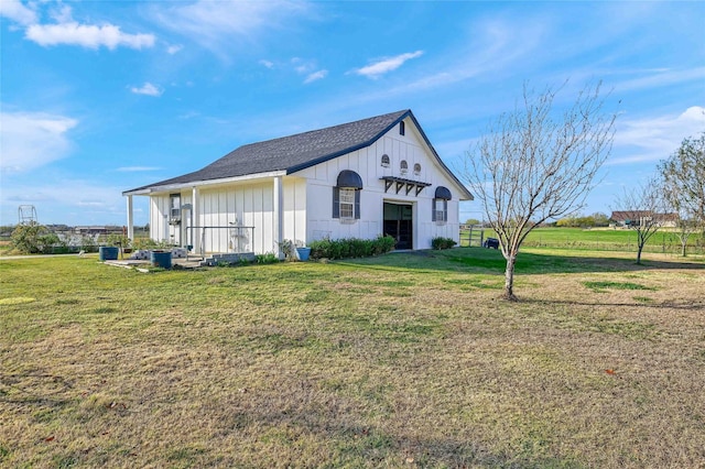 view of side of home featuring a yard