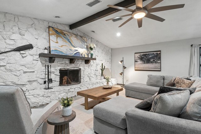 living room featuring a fireplace, vaulted ceiling with beams, ceiling fan, and concrete floors