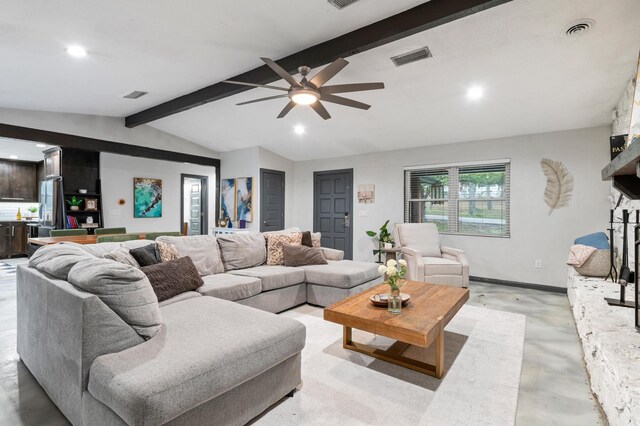 living room with lofted ceiling with beams, a stone fireplace, and ceiling fan