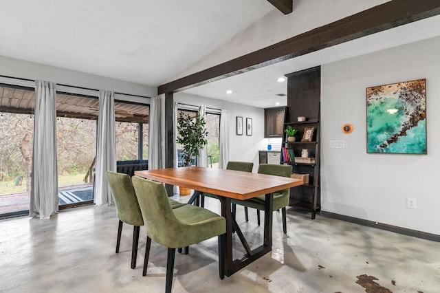 dining room featuring lofted ceiling with beams