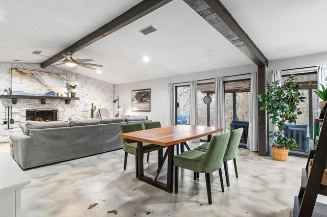 dining area with sink and lofted ceiling with beams