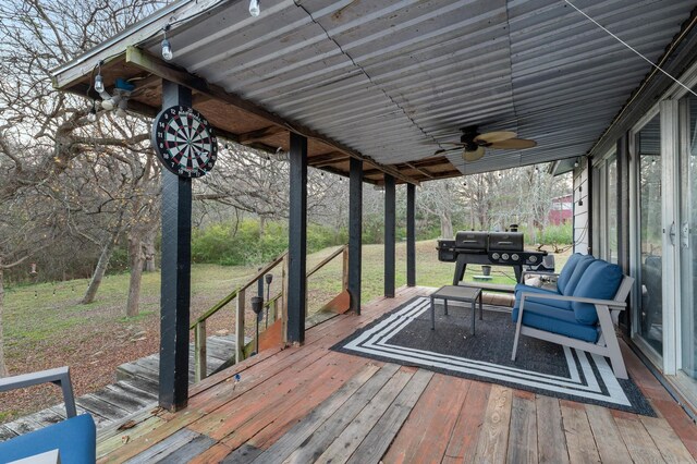 view of patio featuring ceiling fan, a deck, and an outdoor hangout area