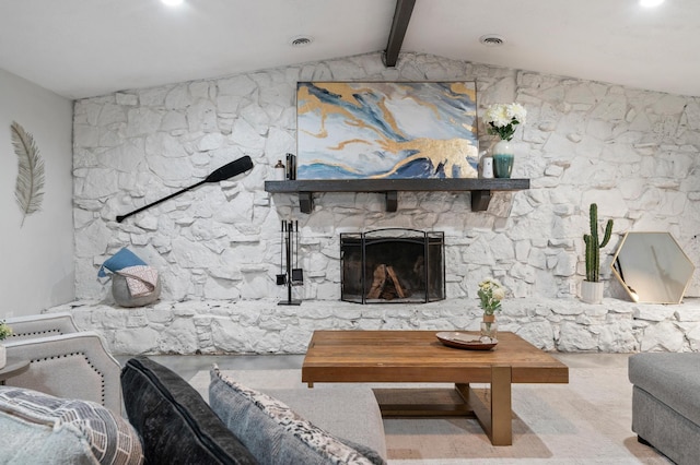 living room with a stone fireplace and vaulted ceiling with beams