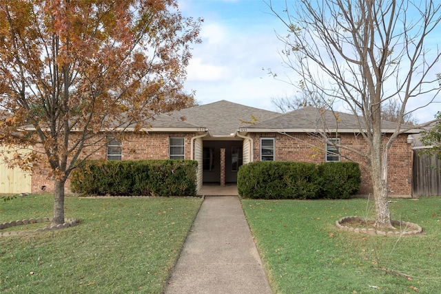 ranch-style house with a front yard