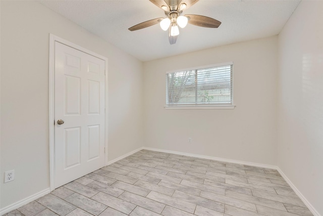 unfurnished room with ceiling fan and light wood-type flooring