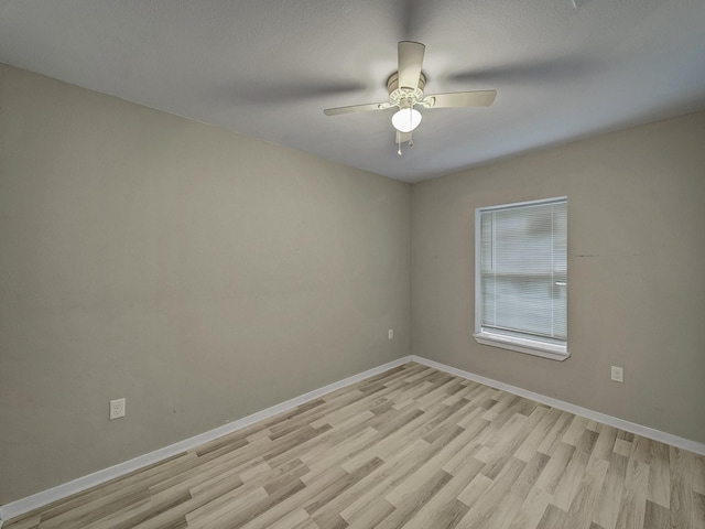 unfurnished room featuring ceiling fan and light hardwood / wood-style floors