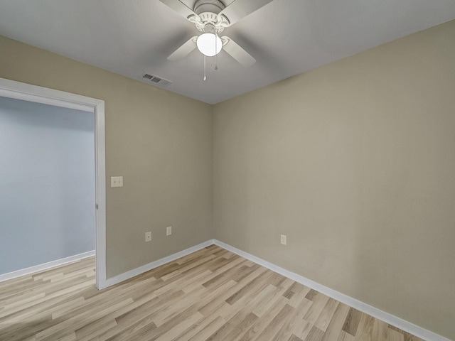 unfurnished room with ceiling fan and light wood-type flooring