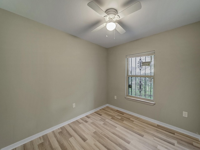 unfurnished room featuring ceiling fan and light hardwood / wood-style flooring