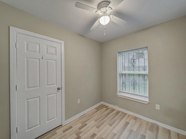 spare room with ceiling fan and light hardwood / wood-style flooring