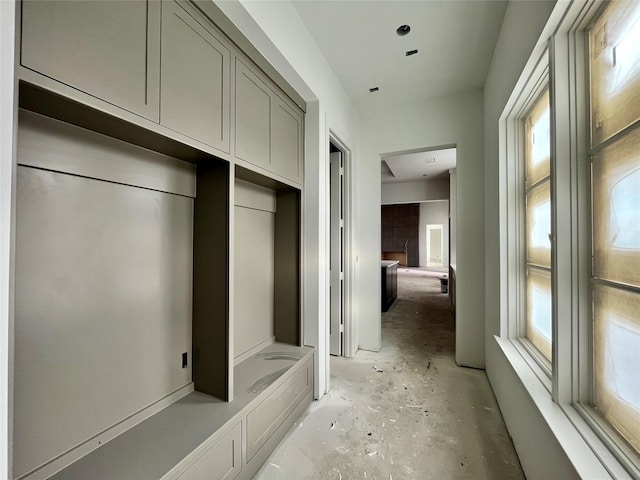 mudroom featuring a fireplace