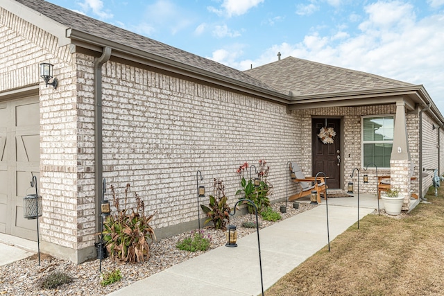 view of exterior entry featuring a garage